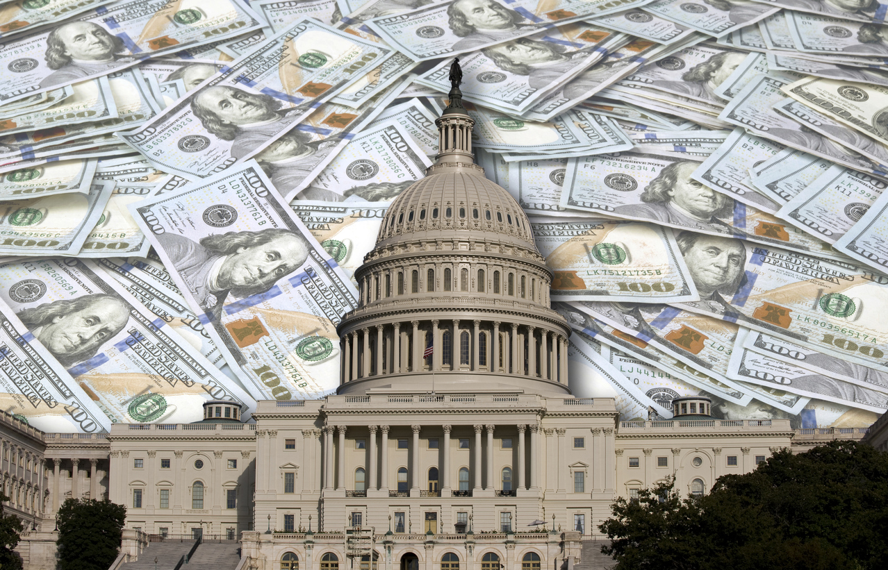 The US capitol building with a background of $100 bills behind it