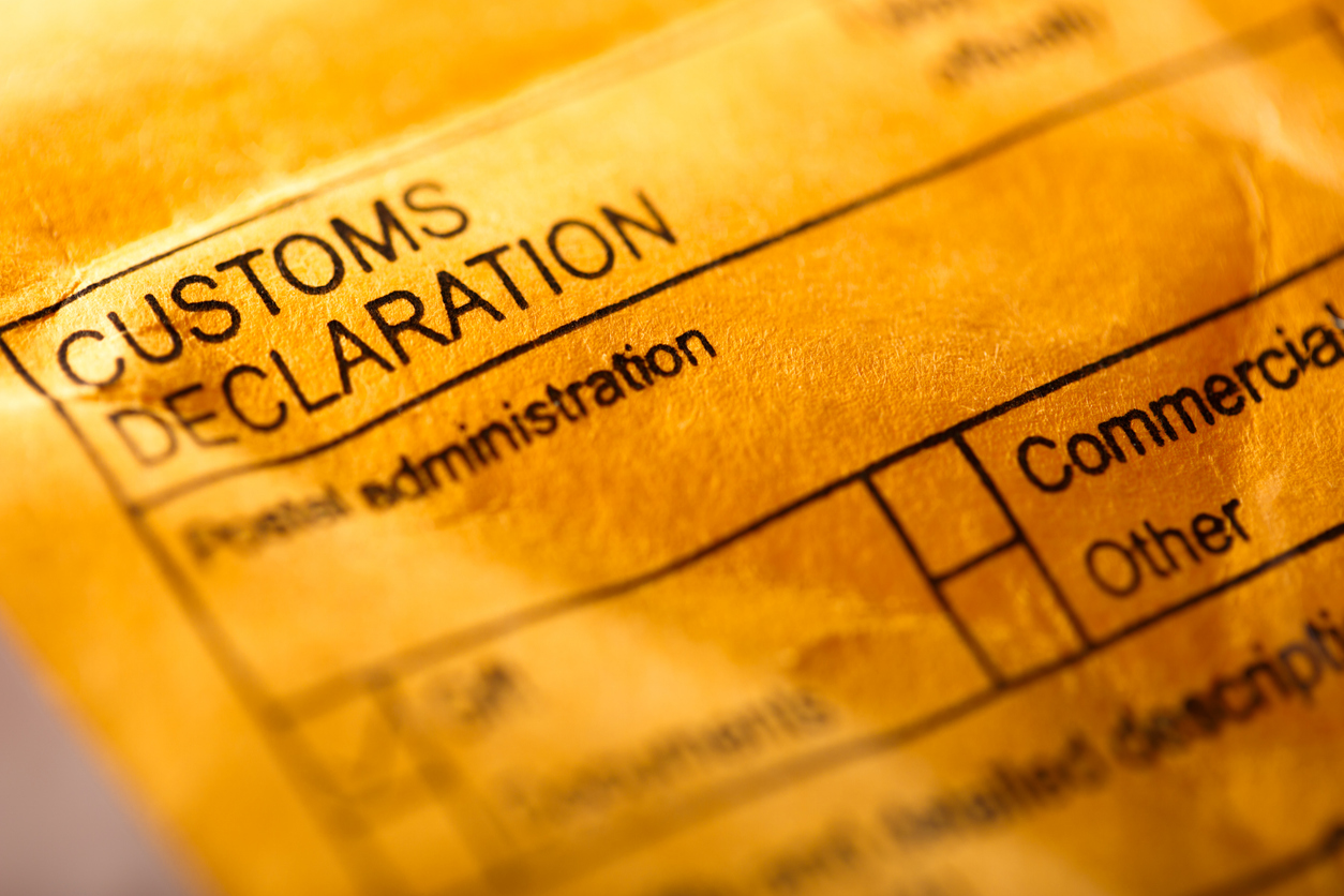 A yellow envelope labeled "Customs Declaration"